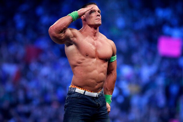 John Cena celebrates his win during Wrestlemania XXX at the Mercedes-Benz Super Dome in New Orleans on Sunday, April 6, 2014. (Jonathan Bachman/AP Images for WWE)