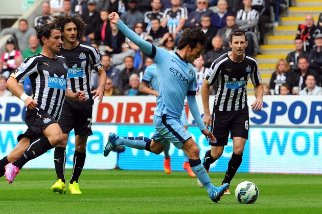 NEWCASTLE UPON TYNE, ENGLAND - AUGUST 17:  David Silva of Man City scores the opening goal during the Barclays Premier League match between Newcastle United and Manchester City at St James' Park on August 17, 2014 in Newcastle upon Tyne, England.  (Photo by Stu Forster/Getty Images)