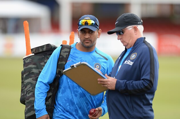 LEICESTER, ENGLAND - JUNE 25:  M S Dhoni, Captain of India and Duncan Fletcher, Head Coach of India  during the India Press Conference and Nets Session at Grace Road on June 25, 2014 in Leicester, England.  (Photo by Tony Marshall/Getty Images)