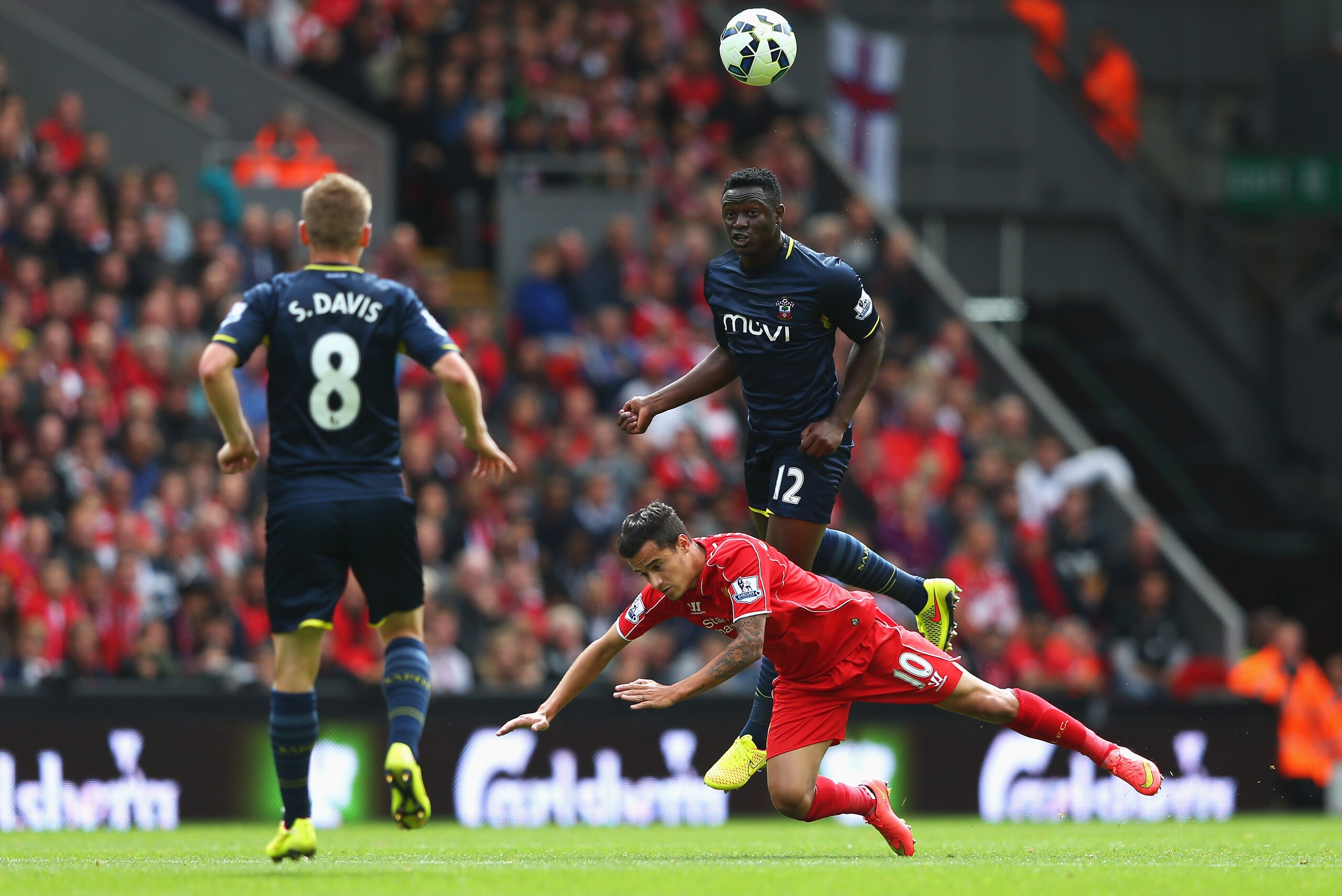 LIVERPOOL, ENGLAND - AUGUST 17: Victor Wanyama of Southampton wins a header with Philippe Coutinho of Liverpool during the Barclays Premier League match between Liverpool and Southampton at Anfield on August 17, 2014 in Liverpool, England.  (Photo by Alex Livesey/Getty Images)