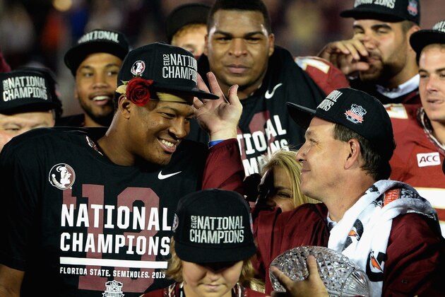 PASADENA, CA - JANUARY 06:  Florida State Seminoles head coach Jimbo Fisher (R) holds the Coaches' Trophy as quarterback Jameis Winston (L) #5 looks on after defeating the Auburn Tigers 34-31 in the 2014 Vizio BCS National Championship Game at the Rose Bowl on January 6, 2014 in Pasadena, California.  (Photo by Harry How/Getty Images)
