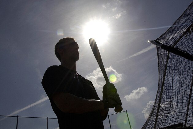 ** ADVANCE FOR  WEEKEND JULY 17-18 ** Ryan Oliva, 21, prepares to take his swings with a wooden bat during batting practice for the Texas Collegiate League in Koppell, Texas, Wednesday, July 14, 2004. There are no aluminum bats in the TCL, the first wooden-bat summer league in the Southwest for college players. More than 200 players from about 75 colleges are playing in the inaugural TCL season. (AP Photo/LM Otero)