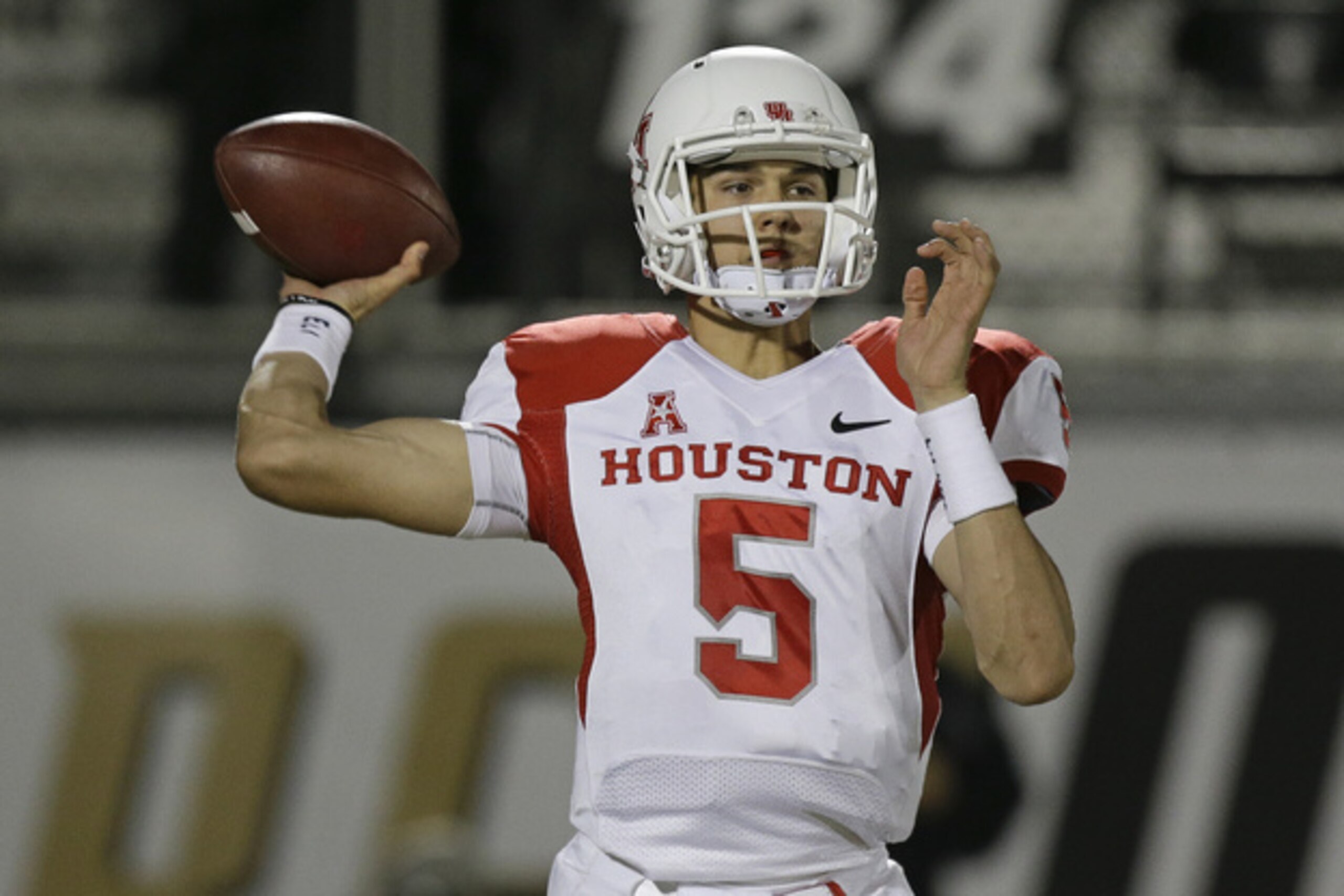 Houston quarterback John O'Korn (5) looks for a receiver during the first half of an NCAA college football game against Central Florida in Orlando, Fla., Saturday, Nov. 9, 2013.(AP Photo/John Raoux) Houston quarterback John O'Korn (5) looks for a receiver during the first half of an NCAA college football game against Central Florida in Orlando, Fla., Saturday, Nov. 9, 2013.(AP Photo/John Raoux)