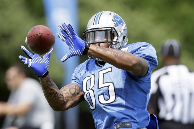 Detroit Lions tight end Eric Ebron runs through drills during an NFL football training camp in Allen Park, Mich., Thursday, July 31, 2014. (AP Photo/Carlos Osorio)