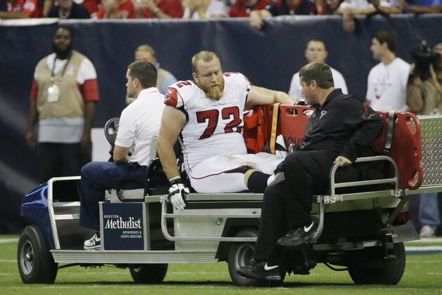 Atlanta Falcons' Sam Baker (72) leaves on a cart after he was injured during the second quarter of an NFL preseason football game against the Houston Texans, Saturday, Aug. 16, 2014, in Houston. (AP Photo/David J. Phillip)