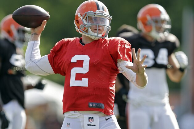Cleveland Browns quarterback Johnny Manziel passes during practice at NFL football training camp in Berea, Ohio Friday, Aug. 15, 2014. (AP Photo/Mark Duncan)