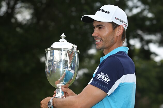 GREENSBORO, NC - AUGUST 17: Camilo Villegas of Colombia poses with the Sam Snead Cup after winning the Wyndham Championship at Sedgefield Country Club on August 17, 2014 in Greensboro, North Carolina. (Photo by Todd Warshaw/Getty Images)