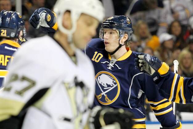Feb. 17, 2013; Buffalo, NY, USA;  Buffalo Sabres defenseman Christian Ehrhoff (10) celebrates a goal with teammates during the second period against the Pittsburgh Penguins at First Niagara Center.  Mandatory Credit: Timothy T. Ludwig-USA TODAY Sports