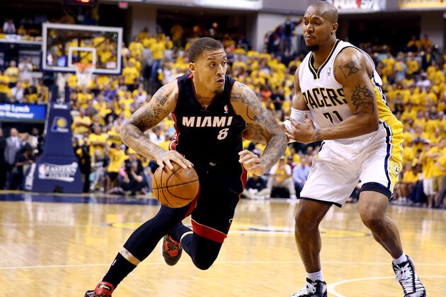 INDIANAPOLIS, IN - MAY 28:  Michael Beasley #8 of the Miami Heat drives to the basket against David West #21 of the Indiana Pacers during Game Five of the Eastern Conference Finals of the 2014 NBA Playoffs at Bankers Life Fieldhouse on May 28, 2014 in Indianapolis, Indiana. NOTE TO USER: User expressly acknowledges and agrees that, by downloading and or using this photograph, User is consenting to the terms and conditions of the Getty Images License Agreement.  (Photo by Andy Lyons/Getty Images)