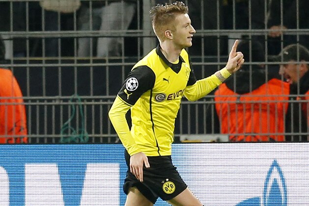 Dortmund's Marco Reus celebrates his side's second goal during the Champions League quarterfinal second leg soccer match between Borussia Dortmund and Real Madrid in the Signal Iduna stadium in Dortmund, Germany, Tuesday, April 8, 2014. (AP Photo/Frank Augstein)
