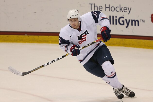 LAKE PLACID, NY - AUGUST 07:  J.T. Compher #21 of Team USA skates against Team Sweden during the 2013 USA Hockey Junior Evaluation Camp at the Lake Placid Olympic Center on August 7, 2013 in Lake Placid, New York.  (Photo by Bruce Bennett/Getty Images)
