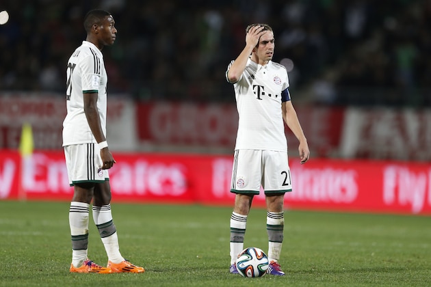 Bayern's Philipp Lahm, right, and team mate David Alaba of Austria wait for a free kick during their semi final soccer match between Guangzhou Evergrande FC and FC Bayern Munich at the Club World Cup soccer tournament in Agadir, Morocco, Tuesday, Dec. 17, 2013. (AP Photo/Matthias Schrader)