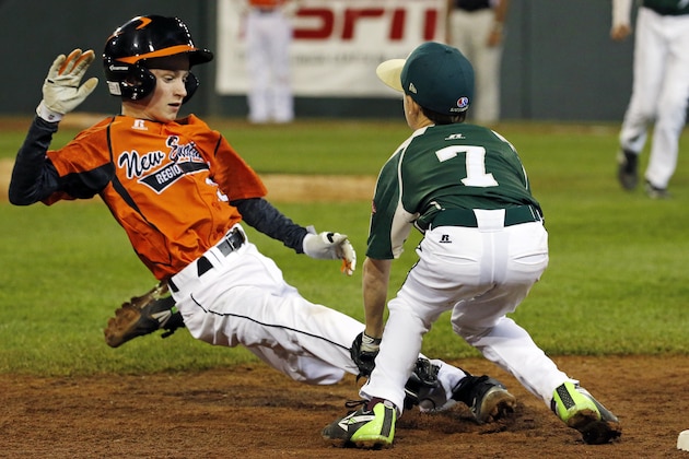 Pearland third baseman Presley Smith (7) tags out Cumberland's CJ Davock attempting to steal third to end the third inning of a baseball game in United States pool play at the Little League World Series tournament in South Williamsport, Pa., Friday, Aug. 15, 2014. (AP Photo/Gene J. Puskar)