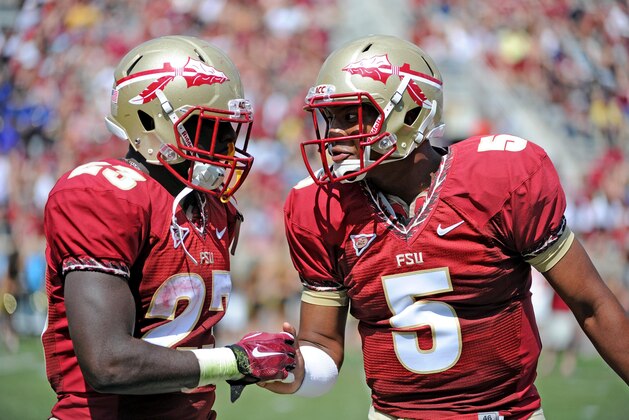 Apr 12, 2014; Tallahassee, FL, USA; Florida State Seminoles quarterback Jameis Winston (5) congratulates fullback Freddie Stevenson (23) after a touchdown during the spring game at Doak Campbell Stadium. Mandatory Credit: Melina Vastola-USA TODAY Sports