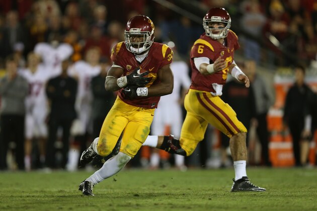 LOS ANGELES, CA - NOVEMBER 16:  Quarterback Cody Kessler #6 of the USC Trojans hands the ball off to running back Javorius Allen #37 against the Stanford Cardinal at Los Angeles Coliseum on November 16, 2013 in Los Angeles, California.  (Photo by Jeff Gross/Getty Images)