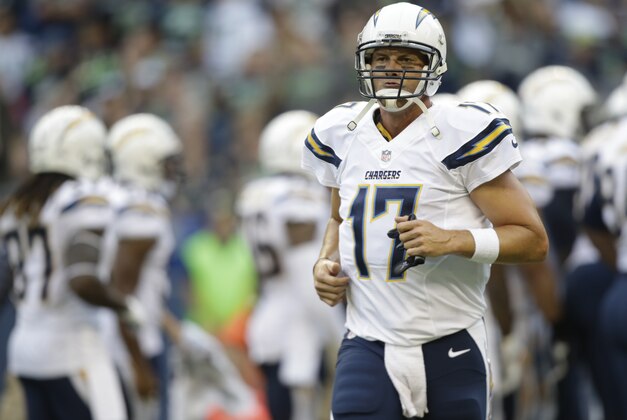 San Diego Chargers quarterback Philip Rivers runs to the sidelines in the first half of a preseason NFL football game against the Seattle Seahawks, Friday, Aug. 15, 2014, in Seattle. (AP Photo/Stephen Brashear)