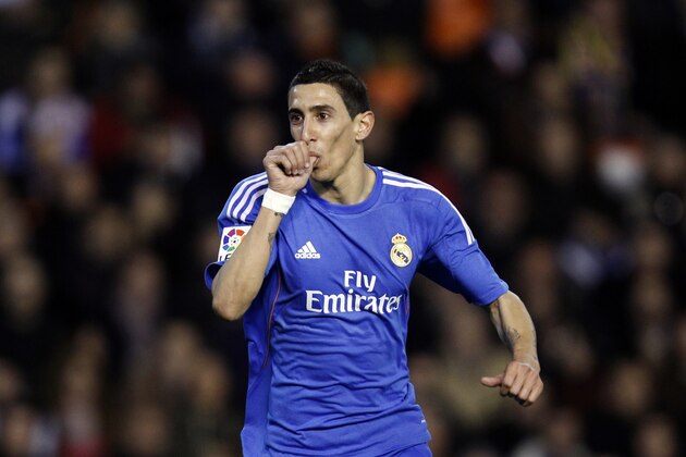 Real Madrid's  Angel Di Maria from Argentina celebrates after scoring against Valencia during their La Liga soccer match at the Mestalla stadium in Valencia, Spain, Sunday, Dec. 22, 2013. (AP Photo/Alberto Saiz)