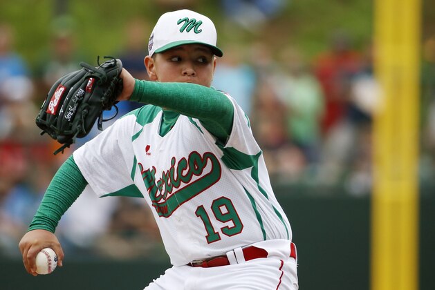Mexico’s Juan Garza pitches during the first inning of an International pool play baseball game against Vancouver at the Little League World Series, Friday, Aug. 15, 2014, in South Williamsport, Pa. Mexico won 4-3. (AP Photo/Matt Slocum)