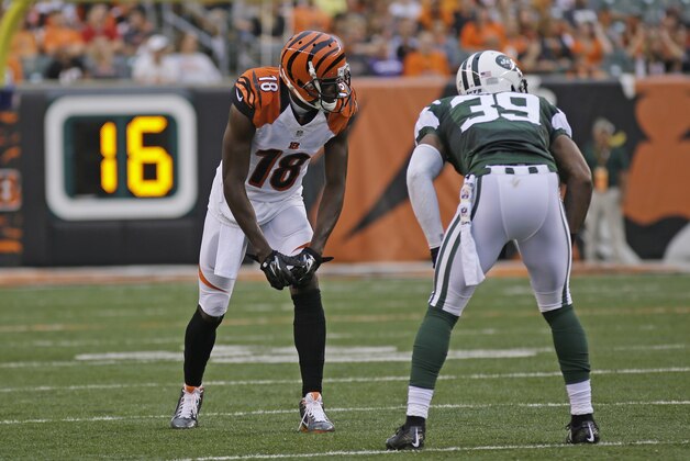Cincinnati Bengals wide receiver A.J. Green (18) lines up against New York Jets free safety Antonio Allen (39) in the first half of an NFL preseason football game, Saturday, Aug. 16, 2014, in Cincinnati. (AP Photo/Tony Tribble)