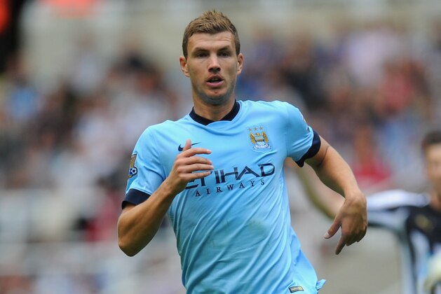 NEWCASTLE UPON TYNE, ENGLAND - AUGUST 17:  Edin Dzeko of Man City in action during the Barclays Premier League match between Newcastle United and Manchester City at St James' Park on August 17, 2014 in Newcastle upon Tyne, England.  (Photo by Stu Forster/Getty Images)