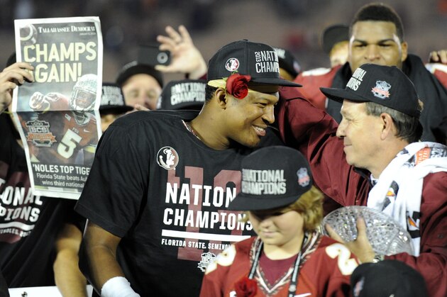 Jan 6, 2014; Pasadena, CA, USA; Florida State Seminoles head coach Jimbo Fisher (right) celebrates with quarterback Jameis Winston (left) after the 2014 BCS National Championship game against the Auburn Tigers at the Rose Bowl.  Mandatory Credit: Kirby Lee-USA TODAY Sports