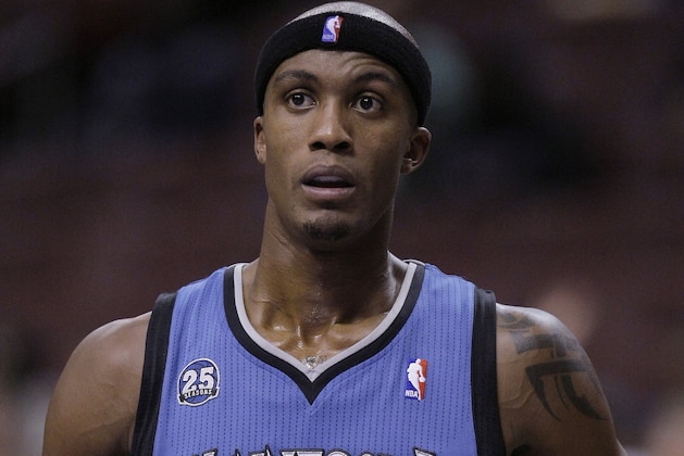In this Oct. 23, 2013, photo, Minnesota Timberwolves' Dante Cunningham pauses during the Timberwolves' preseason NBA basketball game against the Philadelphia 76ers in Philadelphia. Police have arrested Cunningham for the second time in three days. Medina, Minn., police Officer Chris McGill says the 26-year-old Cunningham was arrested Sunday, April 6, 2014, on preliminary charges of making terrorist threats. He declined to go into detail about the allegations but said police would release more information about the arrest on Monday. (AP Photo/Laurence Kesterson)