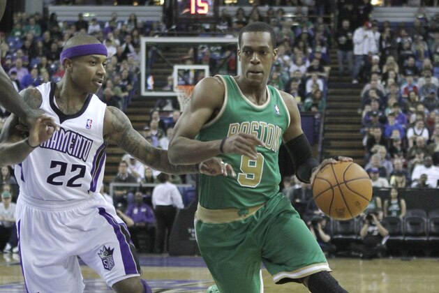 Boston Celtics guard Rajon Rondo, right, drives against Sacramento Kings guard Isaiah Thomas during the first quarter of an NBA basketball game in Sacramento, Calif., March 16, 2012. (AP Photo/Rich Pedroncelli)