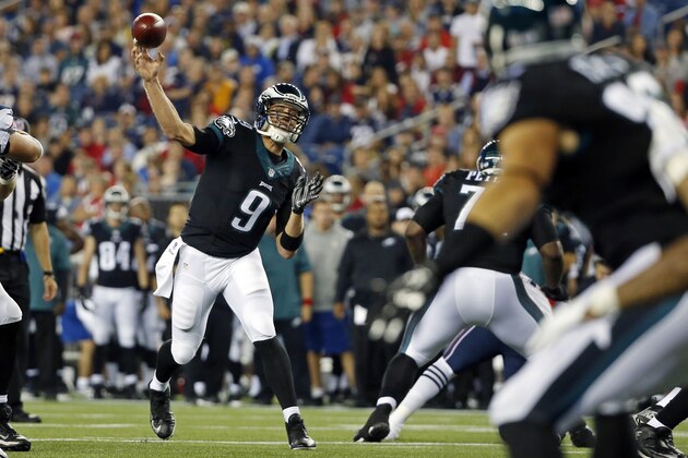 Philadelphia Eagles quarterback Nick Foles (9) throws a pass in the first half of an NFL preseason football game against the New England Patriots Friday, Aug. 15, 2014, in Foxborough, Mass. (AP Photo/Elise Amendola)