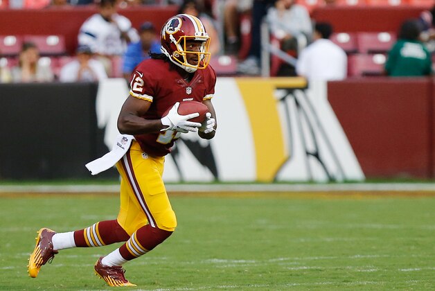 Aug 7, 2014; Landover, MD, USA; Washington Redskins wide receiver Andre Roberts (12) runs with the ball against the New England Patriots at FedEx Field. Mandatory Credit: Geoff Burke-USA TODAY Sports