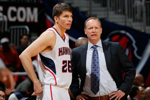 ATLANTA, GA - DECEMBER 06:  Kyle Korver #26 and Mike Budenholzer of the Atlanta Hawks converse during the game against the Cleveland Cavaliers at Philips Arena on December 6, 2013 in Atlanta, Georgia.  NOTE TO USER: User expressly acknowledges and agrees that, by downloading and or using this photograph, User is consenting to the terms and conditions of the Getty Images License Agreement.  (Photo by Kevin C. Cox/Getty Images)
