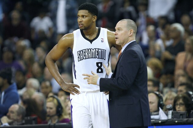 Sacramento Kings head coach Michael Malone, right, and forward Rudy Gay confer during the second half of an NBA basketball game against the Miami Heat in Sacramento, Calif., on Friday, Dec. 27, 2013.(AP Photo/Steve Yeater)