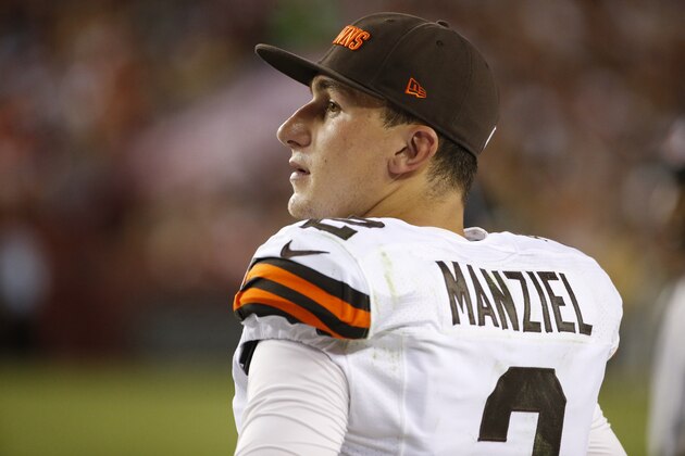 Cleveland Browns quarterback Johnny Manziel (2) watches from the sidelines during the first half of an NFL preseason football game against the Washington Redskins Monday, Aug. 18, 2014, in Landover, Md. (AP Photo/Evan Vucci)