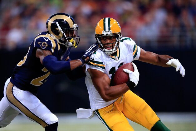 ST LOUIS, MO - AUGUST 16:  Jarrett Boykin #11 of the Green Bay Packers carries the ball upfield after making a catch as Rodney McLeod #23 of the St. Louis Rams defends during the preseason game at Edward Jones Dome on August 16, 2014 in St Louis, Missouri.  (Photo by Jamie Squire/Getty Images)