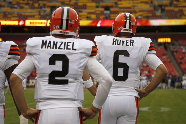 Cleveland Browns quarterback Johnny Manziel stands with quarterback Brian Hoyer before an NFL preseason football game against the Washington Redskins Monday, Aug. 18, 2014, in Landover, Md. (AP Photo/Evan Vucci) Cleveland Browns quarterback Johnny Manziel stands with quarterback Brian Hoyer before an NFL preseason football game against the Washington Redskins Monday, Aug. 18, 2014, in Landover, Md. (AP Photo/Evan Vucci)