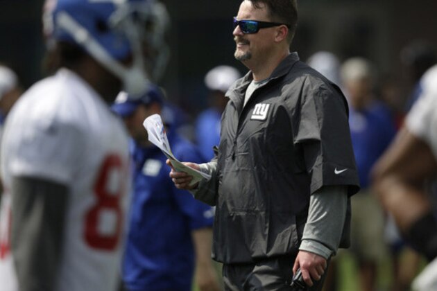 Offensive coordinator Ben McAdoo watches practice during a NFL football camp in East Rutherford, N.J., Wednesday, July 23, 2014. (AP Photo/Seth Wenig)