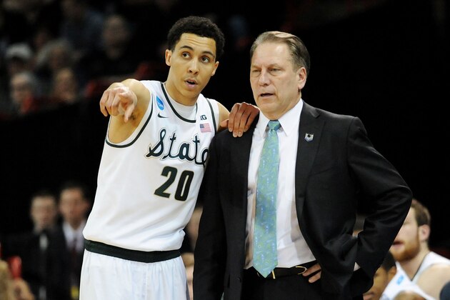 SPOKANE, WA - MARCH 22:  Head coach Tom Izzo and Travis Trice #20 of the Michigan State Spartans talk in the second half against the Harvard Crimson during the Third Round of the 2014 NCAA Basketball Tournament at Spokane Veterans Memorial Arena on March 22, 2014 in Spokane, Washington.  (Photo by Steve Dykes/Getty Images)