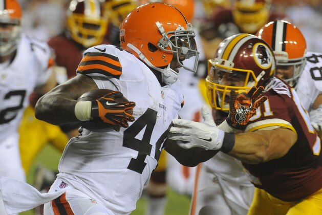 Cleveland Browns running back Ben Tate (44) tries to get away from Washington Redskins linebacker Everette Brown (51) during the first half of an NFL preseason football game Monday, Aug. 18, 2014, in Landover, Md. (AP Photo/Richard Lipski)