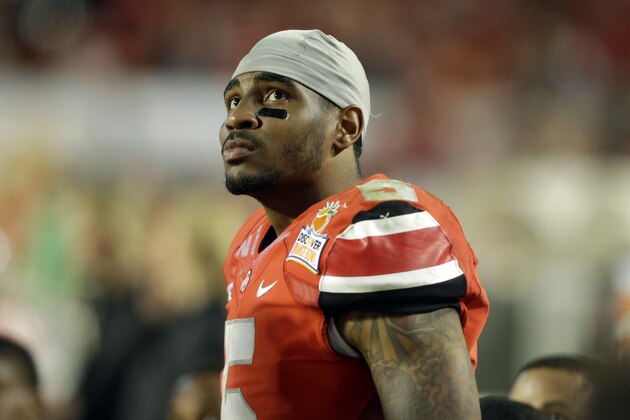 Ohio State quarterback Braxton Miller (5) watches from the sideline during the second half of the Orange Bowl NCAA college football game, Friday, Jan. 3, 2014, in Miami Gardens, Fla. Clemson defeated Ohio State 40-35.  (AP Photo/Wilfredo Lee)
