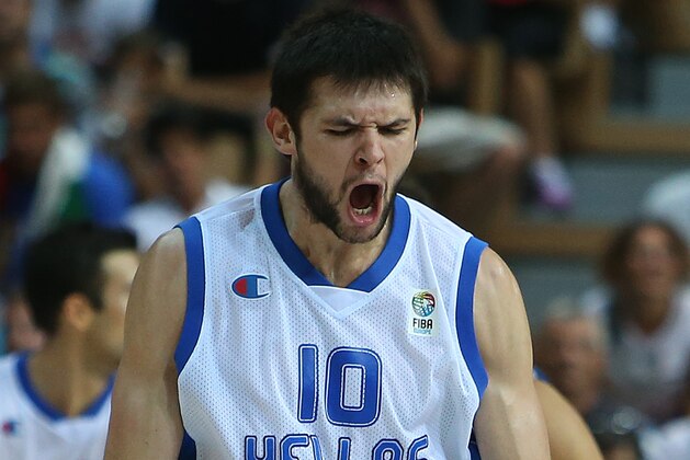 Greece's Kostas Papanikolaou reacts after scoring a three-point shot against Italy during their EuroBasket European Basketball Championship Group D match at the Bonifika Arena, in Koper, Slovenia, Sunday, Sept. 8, 2013. (AP Photo/Thanassis Stavrakis)