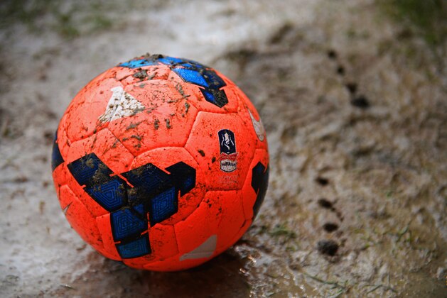SHEFFIELD, ENGLAND - JANUARY 26:  A pink Nike Incyte ball is seen on the muddy pitch prior to the FA Cup with Budweiser fourth round match between Sheffield United and Fulham at Bramall Lane on January 26, 2014 in Sheffield, England.  (Photo by Michael Regan/Getty Images)