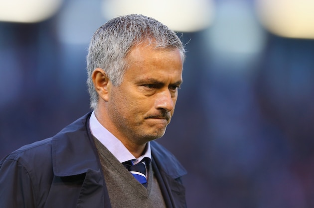BURNLEY, ENGLAND - AUGUST 18:  Chelsea manager Jose Mourinho walks to the dug out prior to the Barclays Premier League match between Burnley and Chelsea at Turf Moor on August 18, 2014 in Burnley, England.  (Photo by Clive Brunskill/Getty Images)