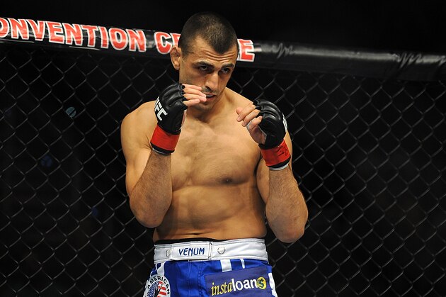 GOLD COAST, AUSTRALIA - DECEMBER 15:  George Sotiropoulos stands in the octagon before the Lightweight bout between George Sotiropoulos and Ross Pearson at Gold Coast Convention and Exhibition Centre on December 15, 2012 on the Gold Coast, Australia.  (Photo by Matt Roberts/Getty Images)