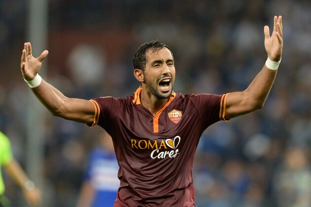 GENOA, ITALY - SEPTEMBER 25:  Mehdi Amine Benatia of AS Roma celebrates scoring the first goal during the Serie A match between UC Sampdoria and AS Roma at Stadio Luigi Ferraris on September 25, 2013 in Genoa, Italy.  (Photo by Claudio Villa/Getty Images)