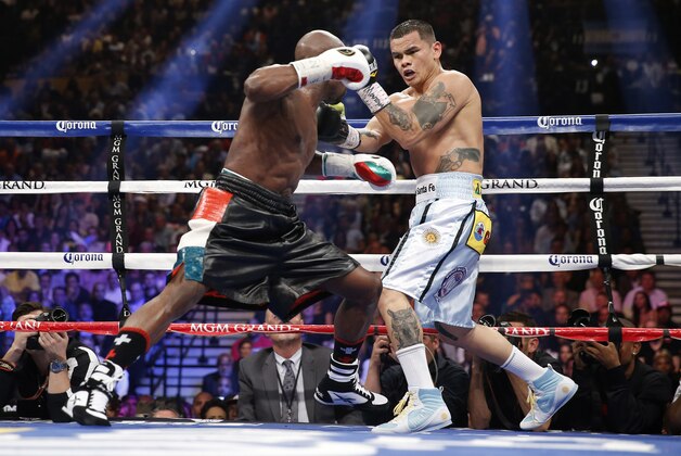 Floyd Mayweather Jr., left, trades blows with Marcos Maidana, from Argentina, in their WBC-WBA welterweight title boxing fight Saturday, May 3, 2014, in Las Vegas. (AP Photo/Eric Jamison) Floyd Mayweather Jr., left, trades blows with Marcos Maidana, from Argentina, in their WBC-WBA welterweight title boxing fight Saturday, May 3, 2014, in Las Vegas. (AP Photo/Eric Jamison)
