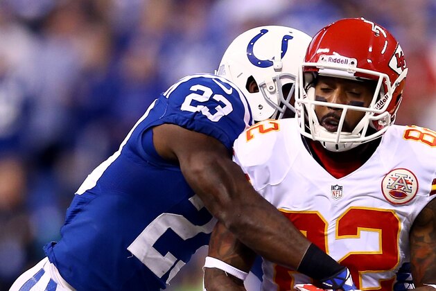 INDIANAPOLIS, IN - JANUARY 04:  Wide receiver Dwayne Bowe #82 of the Kansas City Chiefs is tackled by cornerback Vontae Davis #23 of the Indianapolis Colts during a Wild Card Playoff game at Lucas Oil Stadium on January 4, 2014 in Indianapolis, Indiana.  (Photo by Andy Lyons/Getty Images)