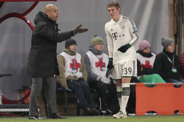 Bayern head coach Pep Guardiola instructs Toni Kroos, right, during the Champions League group D soccer match between CSKA Moscow and Bayern Munich in Moscow, Russia, Wednesday, Nov. 27, 2013. (AP Photo/Ivan Sekretarev)
