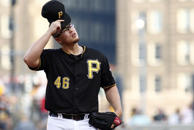 PITTSBURGH, PA - AUGUST 18:  Vance Worley #46 of the Pittsburgh Pirates reacts while giving up six runs on five hits in the first inning against the Atlanta Braves during the game at PNC Park on August 18, 2014 in Pittsburgh, Pennsylvania.  (Photo by Justin K. Aller/Getty Images)