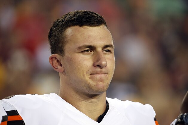 Cleveland Browns quarterback Johnny Manziel (2) stands during the National Anthem before an NFL preseason football game against the Washington Redskins Monday, Aug. 18, 2014, in Landover, Md. (AP Photo/Alex Brandon)
