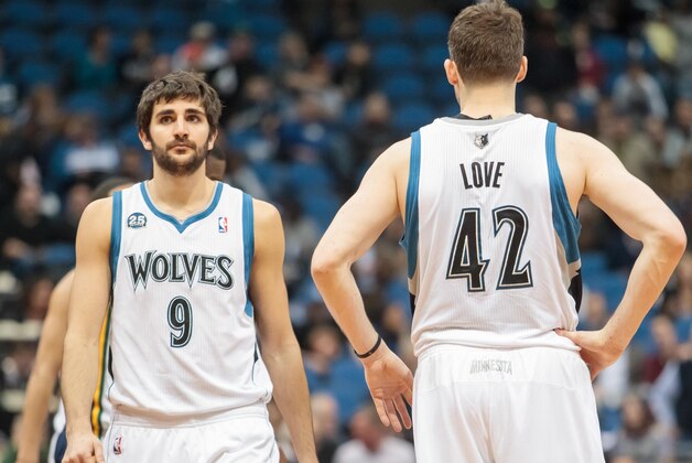 Apr 16, 2014; Minneapolis, MN, USA; Minnesota Timberwolves guard Ricky Rubio (9) and forward Kevin Love (42) at Target Center. Mandatory Credit: Brad Rempel-USA TODAY Sports