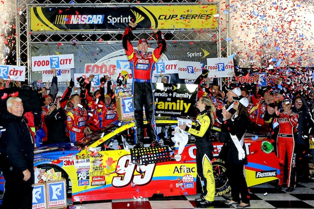 BRISTOL, TN - MARCH 16:  Carl Edwards, driver of the #99 Kellogg's / Frosted Flakes Ford, celebrates in Victory Lane after taking the checkered flag under caution to win the NASCAR Sprint Cup Series Food City 500 at Bristol Motor Speedway on March 16, 2014 in Bristol, Tennessee.  (Photo by Jerry Markland/Getty Images)